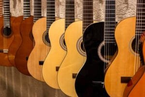 Group of acoustic guitars in a music shop. Musical instruments for sale.